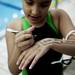 Plymouth Canton Cruiser member Diya Ganguli writes upcoming heats on her arm on Monday, July 29. Daniel Brenner I AnnArbor.com